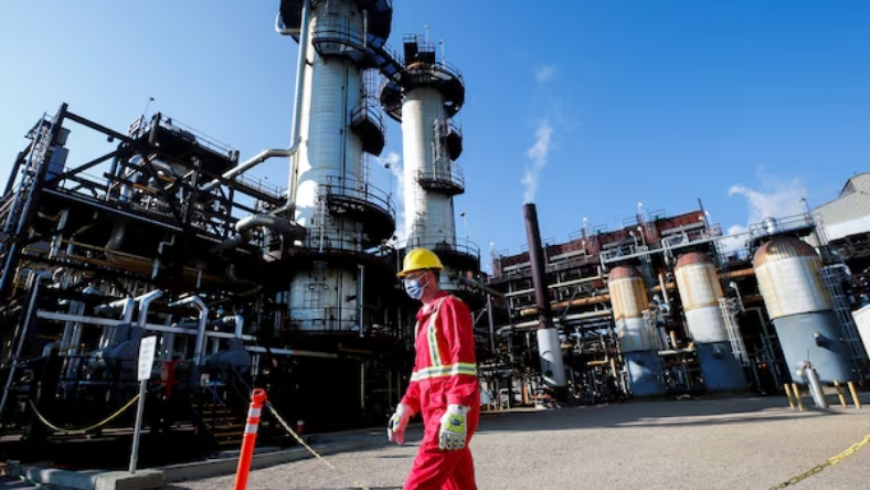 Industrial carbon capture facility with refinery stacks and CO₂ processing units