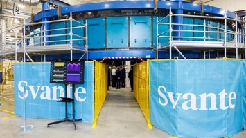 Large blue carbon capture unit on scaffolding with Svante branding inside a warehouse